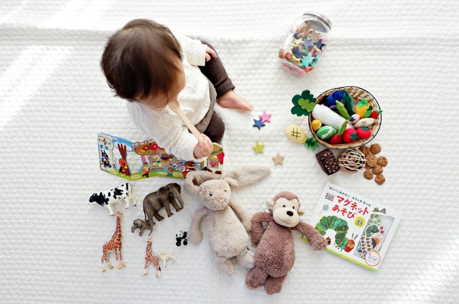 A toddler playing with toys on a soft blanket